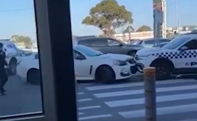 Bystanders filmed the panicked escape in which the man rammed two police vehicles before escaping at Melbourne's Campbellfield Plaza