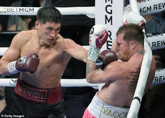 Bivol is trying to become undisputed champion after beating Mexican legend Canelo Alvarez (right) in May