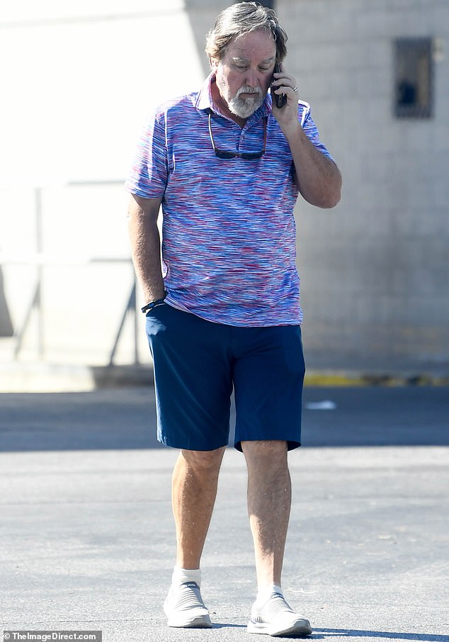 Karn wore a red and blue golf shirt and navy blue shorts with gray loafers. He had slimmed down from his sturdy '90s figure, but his white beard and gray hair made him look unrecognizable compared to the thick, dark hair he sported on Home Improvement.