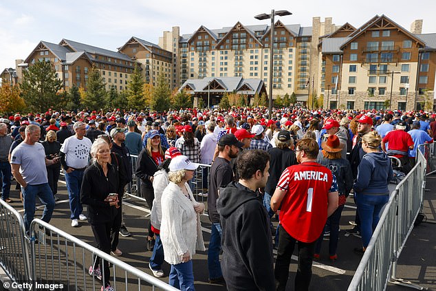 People line up to hear the Republican presidential candidate, former US President Donald Trump, speak