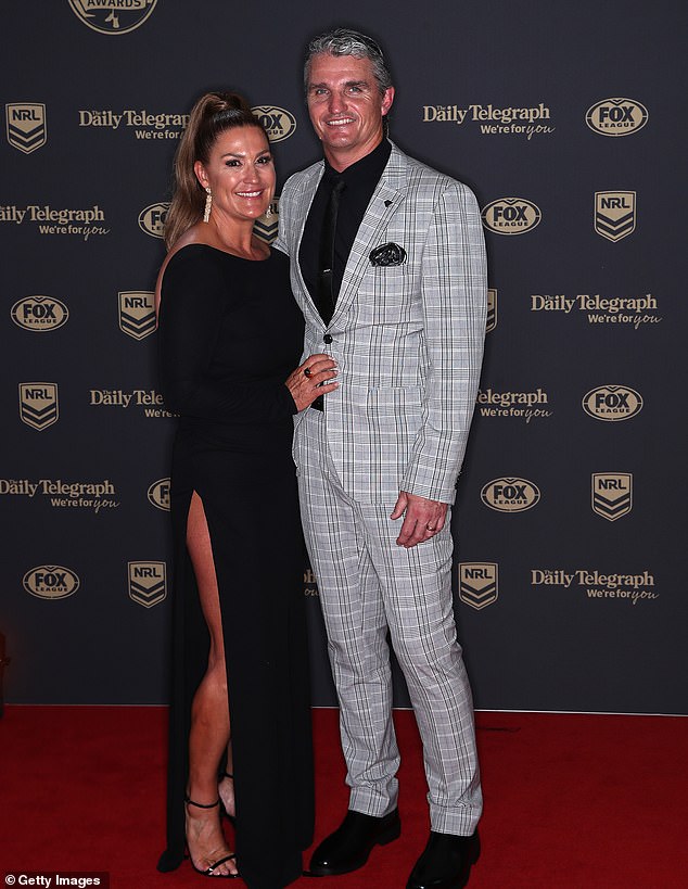 Cleary (pictured with wife Rebecca) is a four-time premiership-winning coach