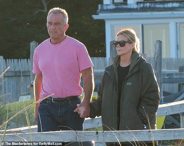 The grieving couple is spotted at the Kennedy Complex in Hyannis Port Massachusetts, taking a walk on the pier