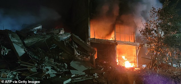 Photos show the widespread damage caused by the airstrike as rescuers search the wreckage for any survivors