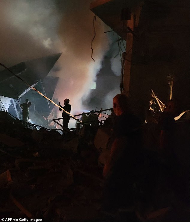 Rescuers search for survivors at the site of an Israeli airstrike on the southern Lebanese city of Nabatiyeh on October 12, 2024