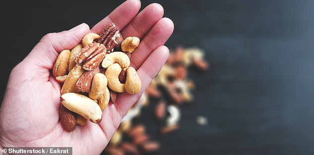 Eating just 30 grams of unsalted and unprocessed nuts reduces the risk of developing the condition by 12 percent (stock photo)