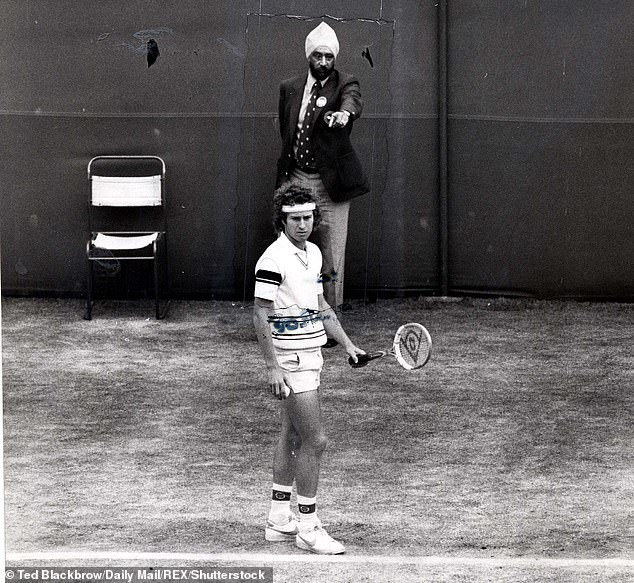 Lines judge Raghbir Singh Mhajan, back, says decision to replace Wimbledon with electronic monitors will spoil 147-year-old tournament