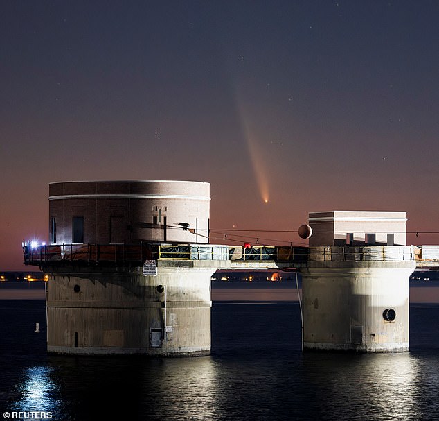 The comet was visible shortly after sunset in the western sky above the Lake Murray Dam Hydroelectric Intake Towers near Columbia, South Carolina.