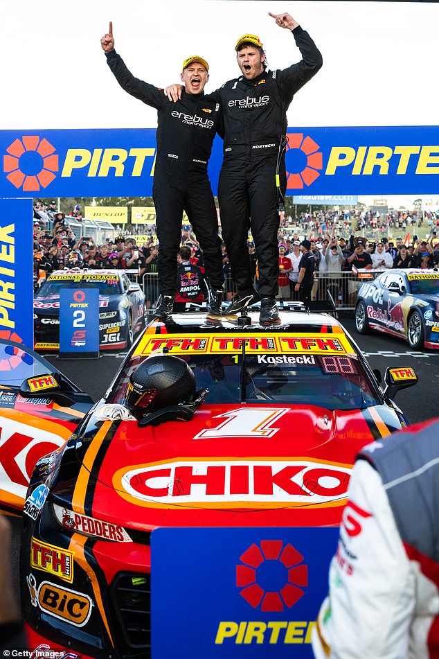 The pair climbed on top of their car after being crowned winners and celebrated with fans at Mount Panorama after the marathon race