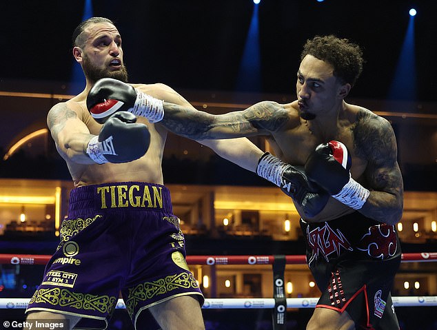 Ben Whittaker (right) was awarded a technical draw after he and Liam Cameron (left) fell through the ropes