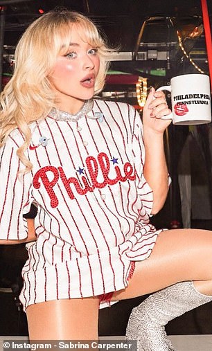 Sabrina Carpenter wears a Phillies jersey