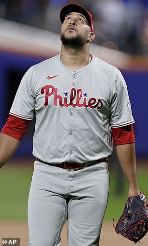 Phillies pitcher Carlos Estevez walks off the field