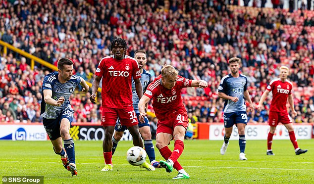 Keskinen pictured (centre) scored a goal in his first appearance for Aberdeen last month