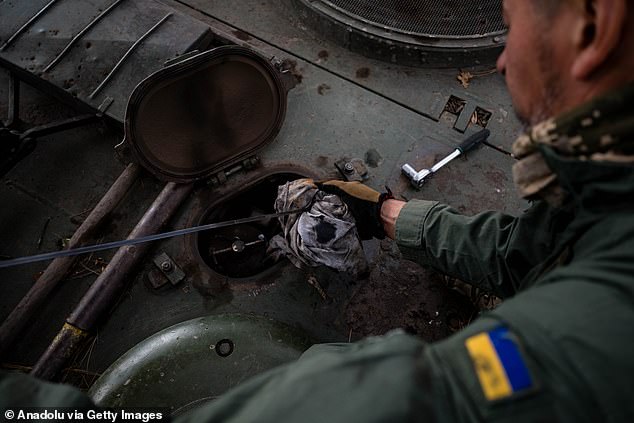 Ukrainian soldiers from the 33rd Brigade maintain his Leopard 2A4