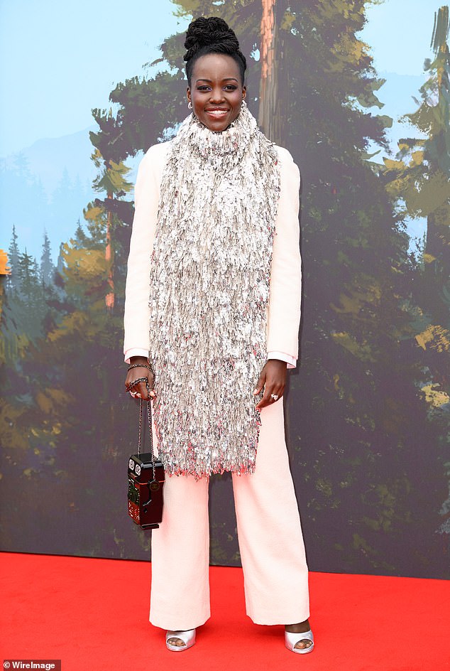 Meanwhile, Black Panther actress Lupita turned heads in a beige suit which she paired with a statement large silver dazzling scarf