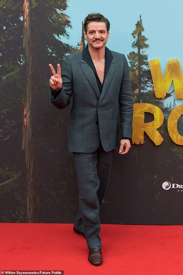 Game Of Thrones star Pedro was all smiles as he posed for photos in a green suit which he teamed with a matching shirt and brown shoes