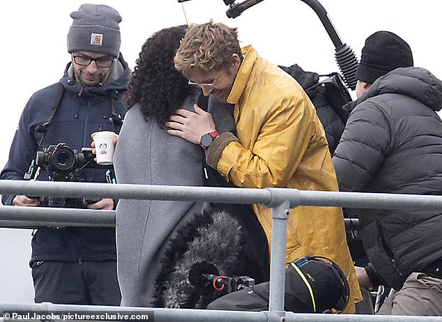 In the scenes, Ryan was seen using a phone while listening to something through wired earphones. He was then seen hugging his co-star, who is yet to be identified