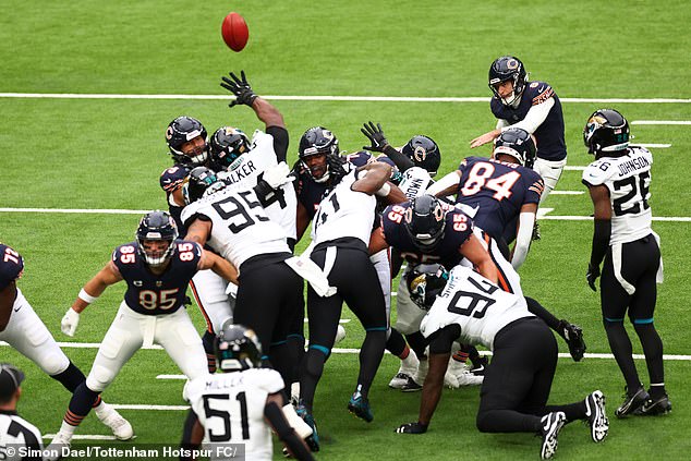 Seconds later, Kmet (left) played his secondary role as the team's long snapper for the PAT