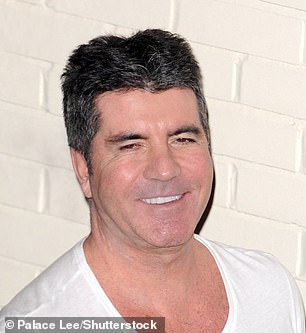 2014: Cowell greets audience members backstage at The X Factor