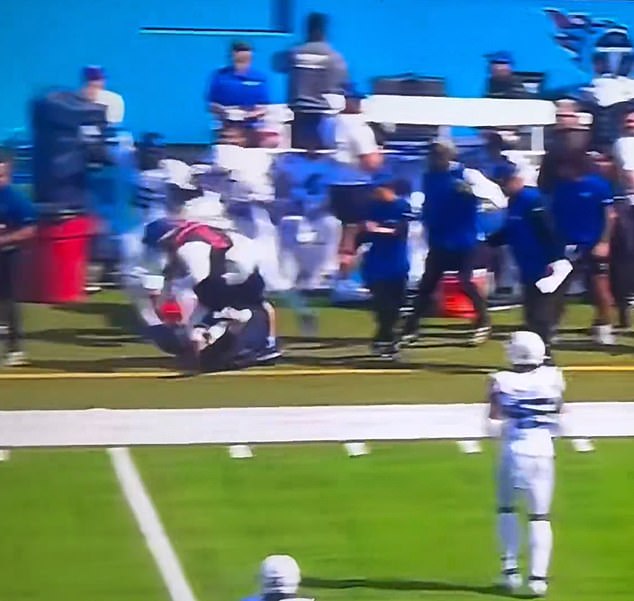 The Titans quarterback accidentally rammed into a sideline, sending him onto the turf