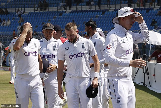 The England players pictured after beating Pakistan by one innings and 47 runs in the first Test