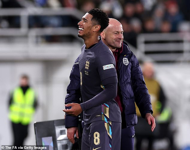 Jude Bellingham (left) was photographed smiling after being subbed off in the 80th minute on Sunday