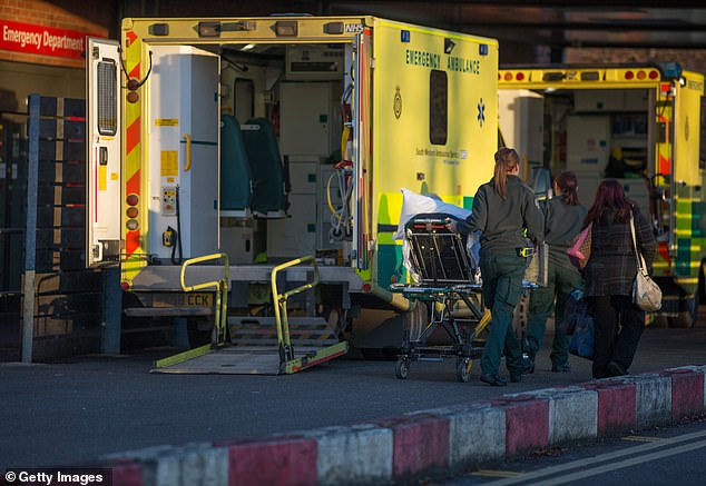 A patient is wheeled out of an ambulance parked outside the emergency department at Gloucestershire Royal Hospital on January 6, 2015 in Gloucester, England