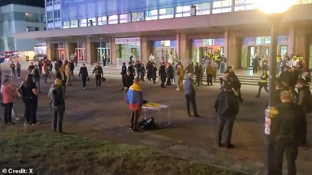 People gathered outside the Palace of Sports venue where Ukrainian rock band Okean Elzy was playing