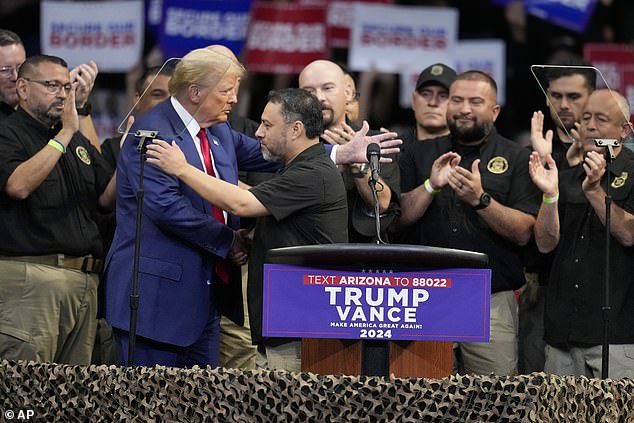 Paul Perez, chairman of the National Border Patrol Council, hugs Republican presidential candidate, former President Donald Trump