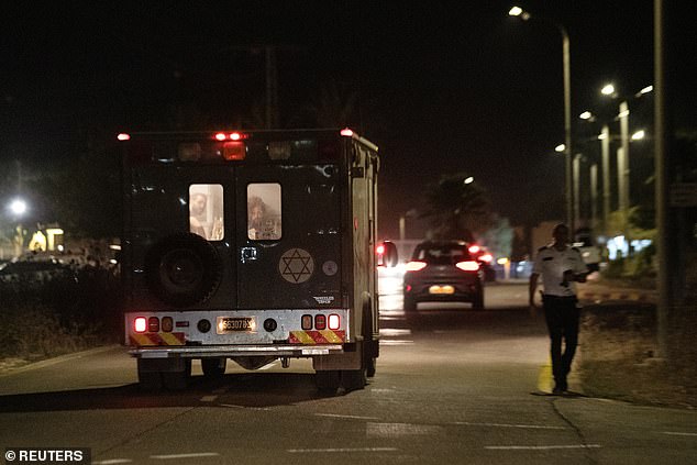 A military ambulance drives near the spot where a drone from Lebanon attacked Israel