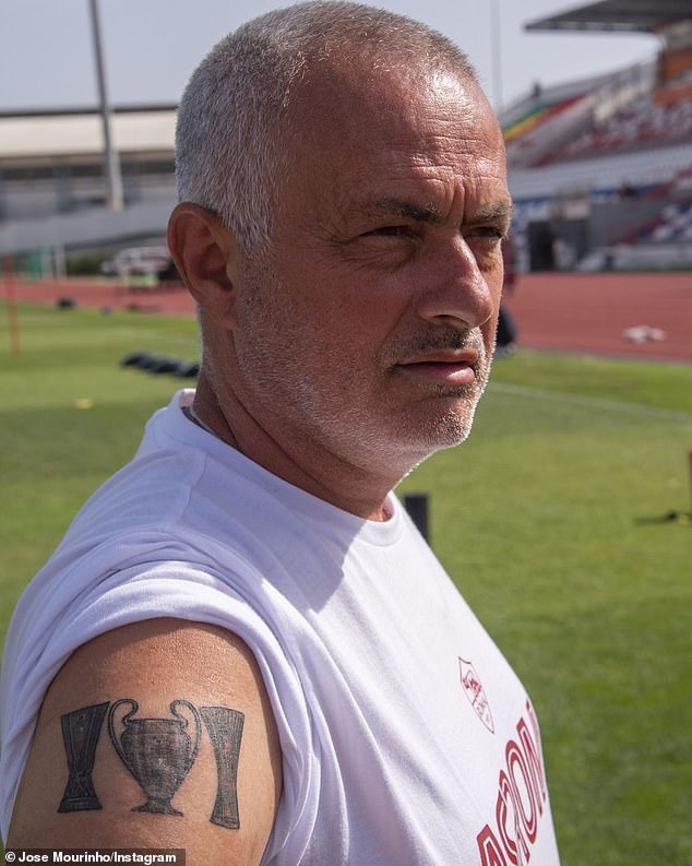 Jose already had ink on his upper right arm from the Champions League trophy, sandwiched between the Europa League and Europa Conference League cups (pictured)