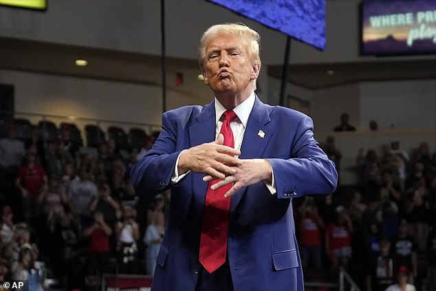 Republican presidential candidate, former President Donald Trump, gestures during a campaign rally at the Findlay Toyota Arena on Sunday, October 13, 2024