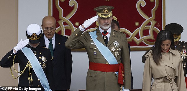 Princess Leonor (pictured, left), King Felipe (pictured, centre) and Queen Letizia (pictured, right) are seen at the event on Saturday