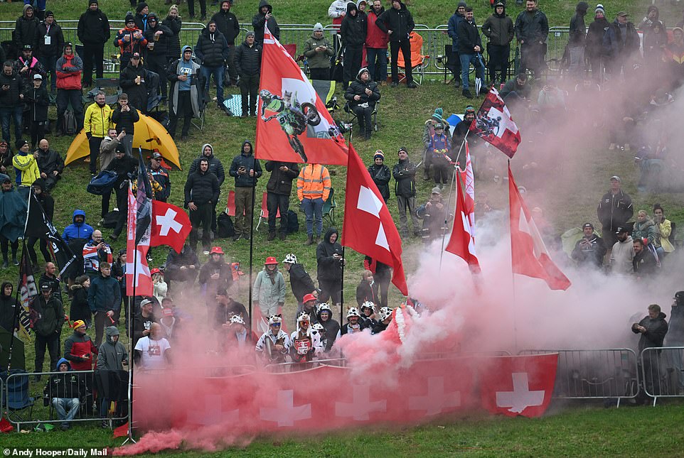 A large Swiss contingent dressed as cows showed their support for their riders by lighting torches next to the railing