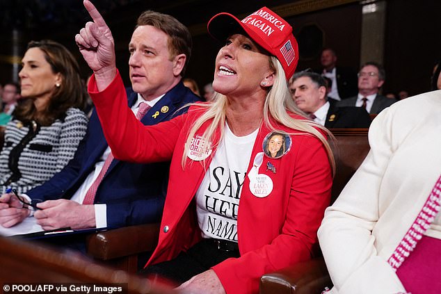 Georgia Republican Rep. Marjorie Taylor Greene yells at US President Joe Biden as he delivers his third State of the Union address