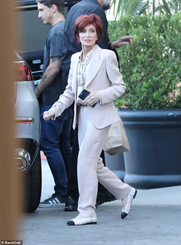 Sharon dazzled in an elegant white suit