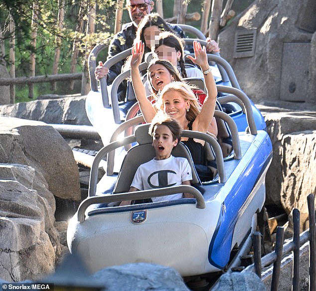 The family seemed to have a blast as they enthusiastically raised their arms on various rides throughout the day