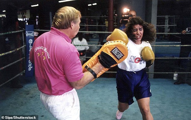 Christy, 56, originally from West Virginia, is credited with putting women's boxing on the map after taking on Deirdre Gogarty in front of a sold-out crowd at the MGM Grand in Las Vegas in 1996 - pictured with Jim in 1996