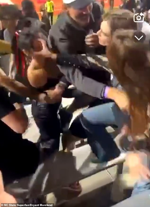 The women continued to fight before some nearby male fans separated them