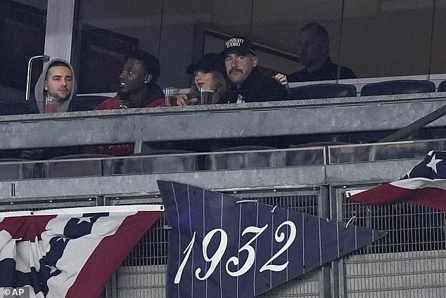 The compartment got cozy and shared a hug as they tried to stay warm at Yankee Stadium