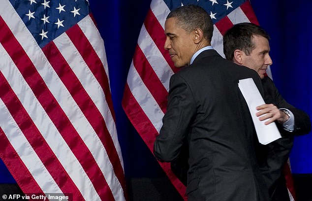 S President Barack Obama greets senior advisor and former campaign manager David Plouffe (L) during a Democratic National Committee (DNC) event in Washington, DC, March 16, 2011