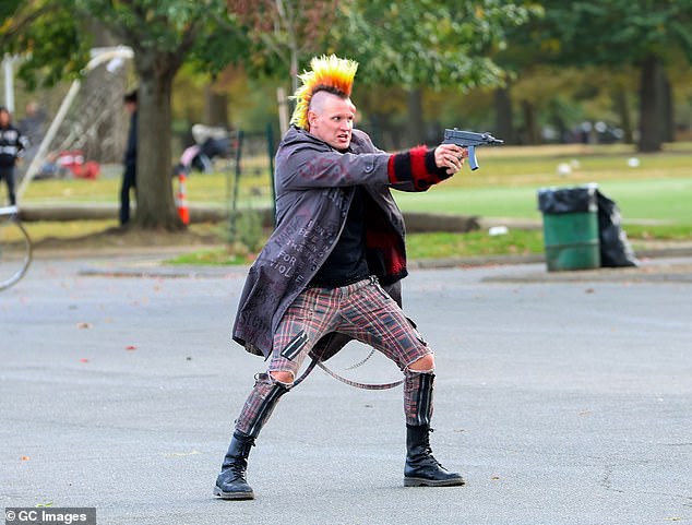 In one tense moment, former Doctor Who star Smith was seen pointing a gun at an unseen target with a furious look on his face