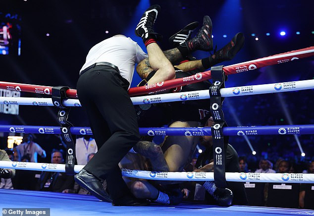 Both fighters had fallen over the ropes, requiring Whittaker to use a wheelchair