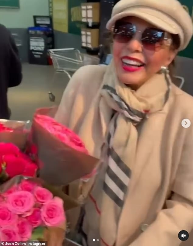 Joan also wore large brown sunglasses while in the store and wore bright red lipstick as she grabbed chicken, salad and a bouquet of roses