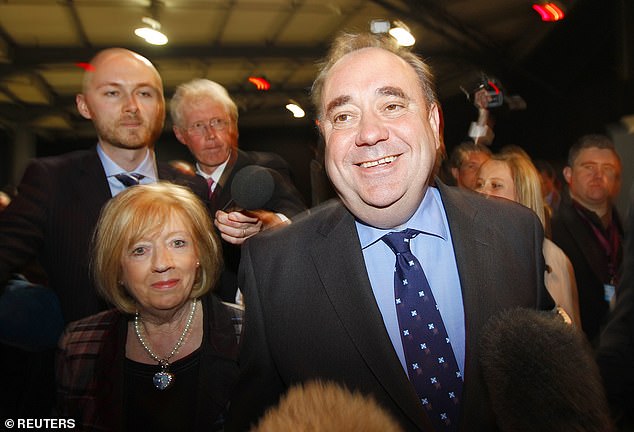 Scottish First Minister and leader of the Scottish National Party, Alex Salmond, arrives with his wife Moira Salmond at the 2011 Scottish Parliament election results