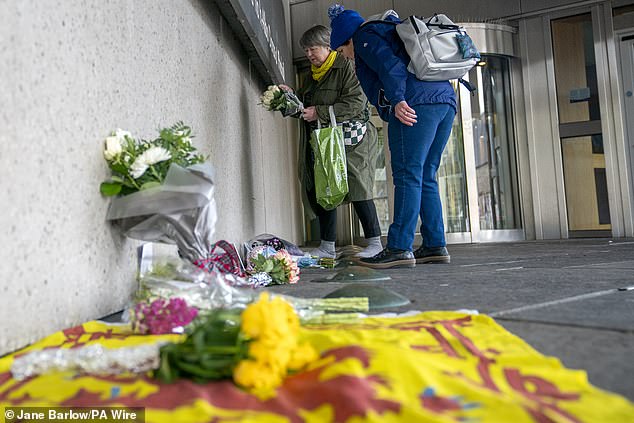 Members of the public left floral tributes to the former First Minister outside the Scottish Parliament