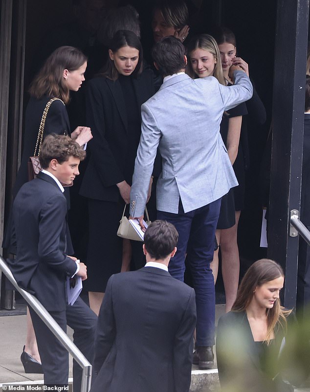 Rarely seen all together, the cousins ​​exemplified their very close bond as they all shared a warm embrace and comforted each other upon their arrival at church (Photo: Hamish hugs on Sunday)