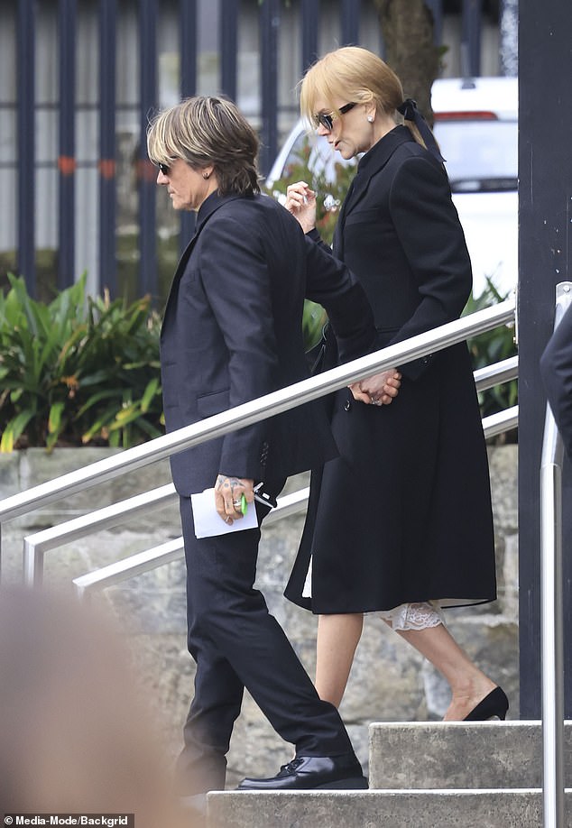 Nicole was seen arriving at the church hand in hand with her loving husband Keith, 56,