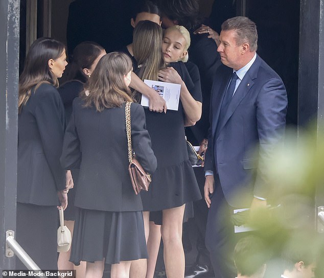 Sunday and Faith were also comforted by Jessica Rowe's model daughter Allegra Overton at their grandmother Janelle's funeral in Sydney on Tuesday (also pictured: Pete Overton)