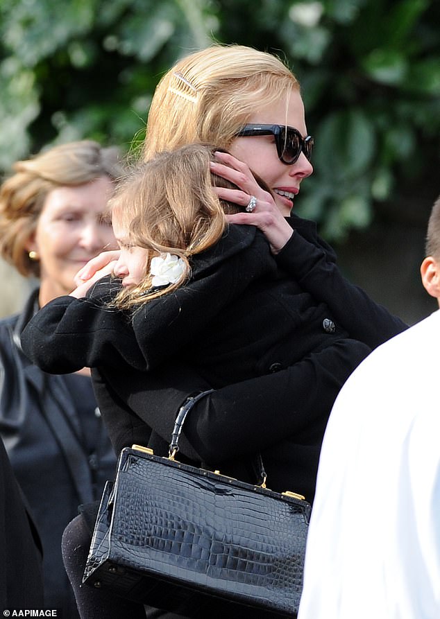 Wearing dark sunglasses, Nicole cried and held her eldest daughter, then six, to her chest on Sunday as pallbearers walked Antony's coffin to the waiting hearse