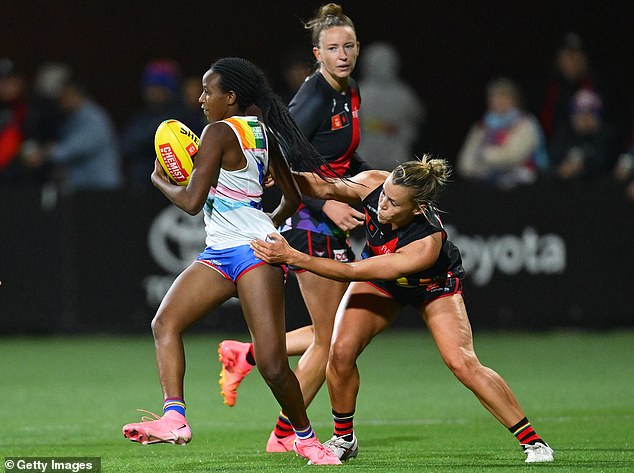 Nine-star Tony Jones says the women's footy league is now at 'crisis point' after Dogs vs Bombers clash (pictured)